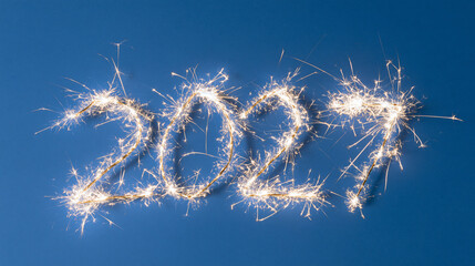 Obraz premium Celebrating new beginnings with sparklers marking the year 2027 against a deep blue backdrop Generative AI