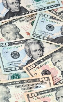 US dollar money bills in pile on table. United States USD currency cash close up