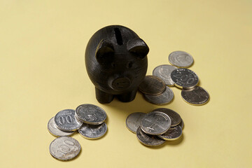 Dark Pig Shaped Decorative Object on Neutral Background © AndhikaRaya