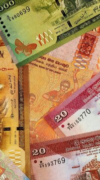 Sri Lankan rupee money bills in pile on table. Sri Lanka LKR currency cash close up