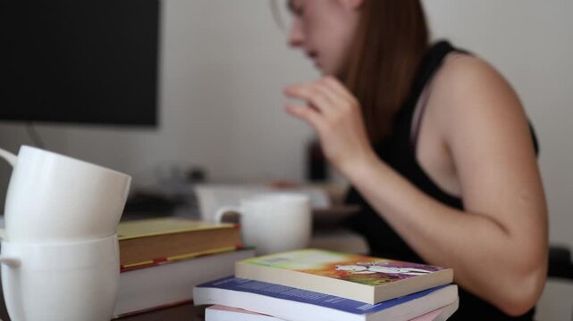 Coffee is gone again as a dedicated student tilts another empty mug realizing how easily long study hours turn caffeine into an unnoticed daily habit