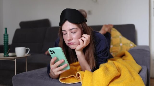 Late night scrolling replaces healthy rest as young woman chases another burst of dopamine through social media despite feeling mentally tired and emotionally empty