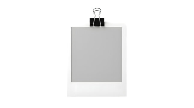 Blank paper memo held by metal binder with office supply stationary business reminder document template organization professional administration paperwork communication attachment fastener