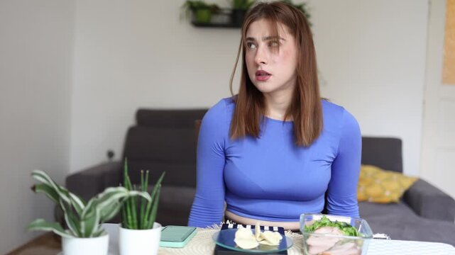 Giving up favorite snacks becomes part of the weight loss journey as a determined woman resists high calorie cravings to stay committed to her healthy eating goals