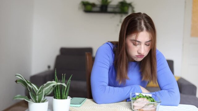 Extreme calorie control turns favorite snacks into a source of frustration as a determined woman reluctantly measures every potato chip before allowing herself to eat