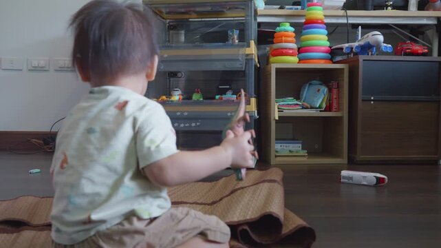 A joyful child enjoys playing with colorful toys in a bright, inviting room, surrounded by various stimulating items that promote creativity and exploration.