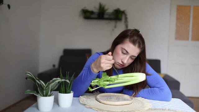 Healthy eating becomes an unhealthy obsession as young woman forces herself to choose celery over satisfaction trapped by constant fear of calories every day