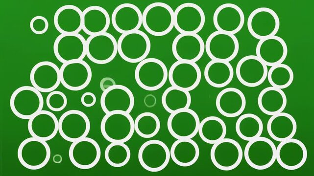 Abstract organic growth pattern with flowing white circles on a vibrant green backdrop