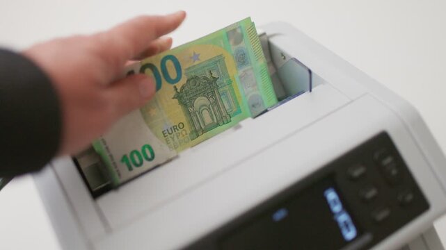 Automated Cash Counter Accurately Counting Stack of European Euro Banknotes