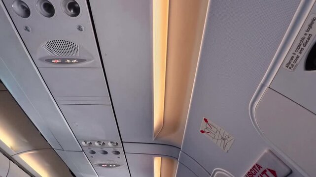 Aircraft Cabin Ceiling With Reading Lights and Air Vents, Flight - TILT UP VIDEO - NO AUDIO	
