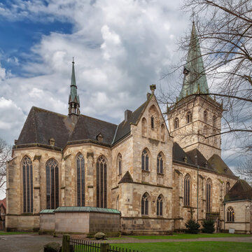 St Felizitas church in Ludinghausen Germany three quarter view from apse. Late gothic hallenkirche under partly cloudy sky