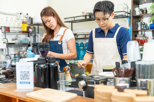 Baristas preparing coffee and matcha beverages for customers at cafe counter, professional drink preparation, specialty coffee and tea shop service, small business hospitality food service industry