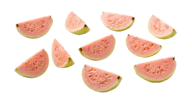Multiple fresh pink guava slices with visible seeds and light green rind arranged on a clean white background.