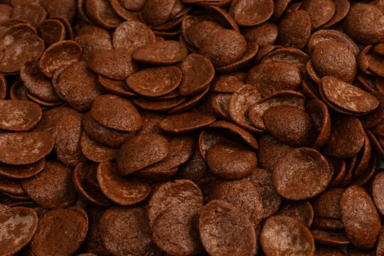 Corn-flakes background and texture. Chocolate cereal.