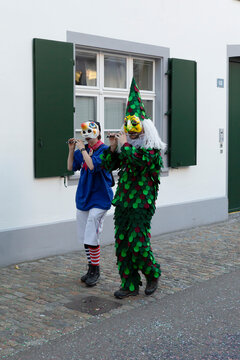 Basel carnival 2026. Two participants wearing costumes and masks