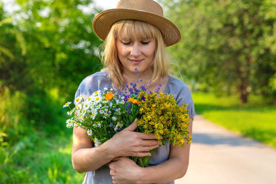 Woman with medicinal herbs. Selective focus.