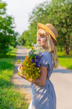 Woman with medicinal herbs. Selective focus.