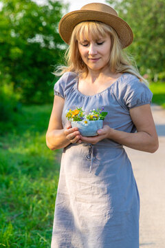 Woman with medicinal herbs. Selective focus.