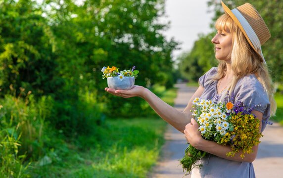 Woman with medicinal herbs. Selective focus.