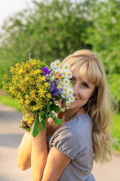 Woman with medicinal herbs. Selective focus.