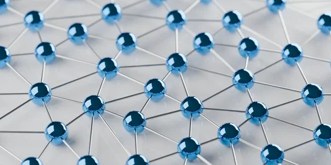 Network of connected blue spheres on white background, social or business network or technology concept, selective focus © Shawn Hempel