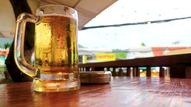 Cold Beer Glass Mug On Bar Table With Ashtray Lifestyle Thailand.