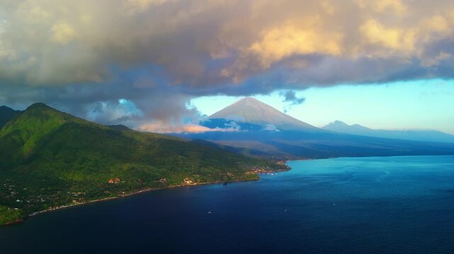 Golden Sunrise Illuminating Amed Coast With Agung Volcano Silhouette