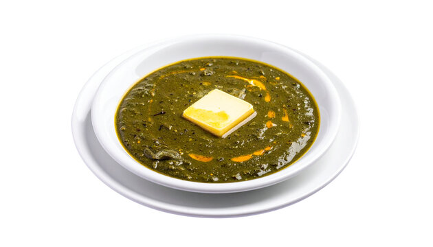 A serving of rich green saag topped with a melting butter cube, vibrant texture and authentic spices, isolated on transparent background