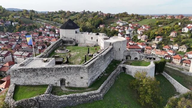 Drone 180 degree orbit shot around historic medieval Tesanj Castle in Bosnia