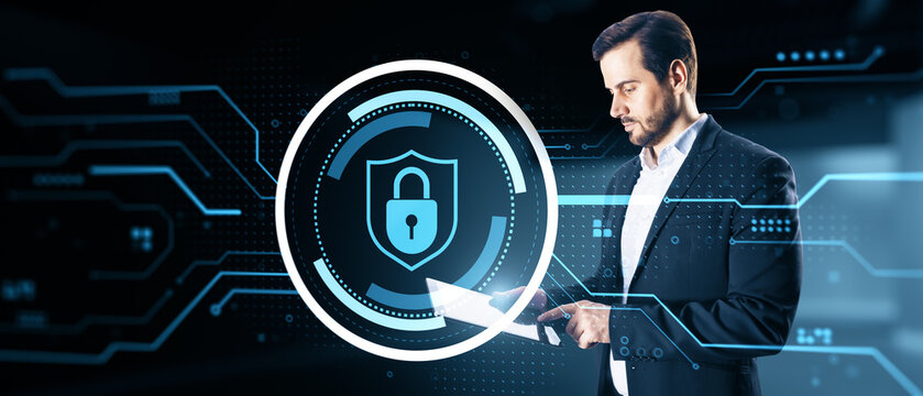 Cybersecurity specialist using a digital shield and lock interface, protecting data, networks, privacy, and secure business systems online.