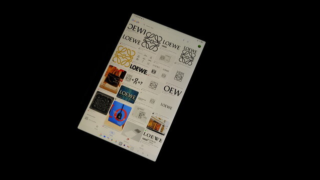 Tablet screen view with various sized Loewe logos, on a black background, August 1, 2026
