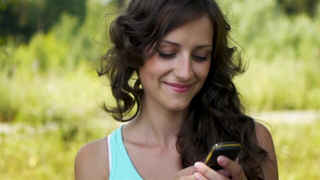 woman reads message to mobile phone