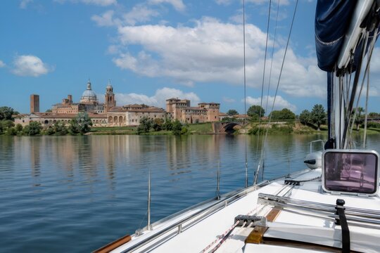 Sailing on mincio river viewing mantua skyline