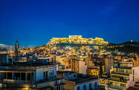 A view at night over the rooftops of Athens towards the Acropolis in Athens, Greece in early summertime