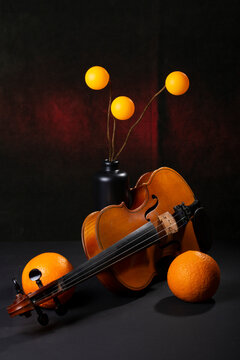 Still Life with colored balloons, two oranges, and a violin
