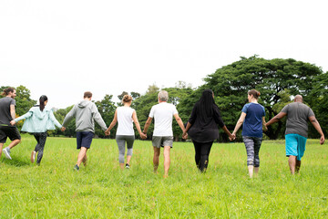 Naklejka premium Diverse group walking together outdoors