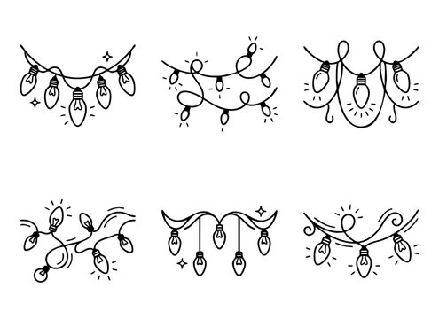 Set of hand drawn Christmas light garlands and fairy lights doodles in sketch style.