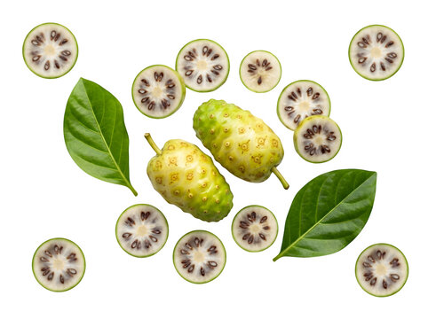 Fresh whole and sliced noni fruit with green leaves isolated on transparent background