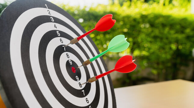 Dart in bullseye of dartboard, concept for business target planning growth and aim to winner goal.