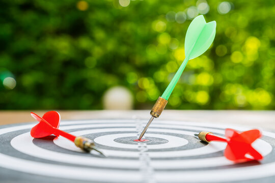 The darts landed in the center of the dartboard, and there were a few unsuccessful attempts where some players fell.