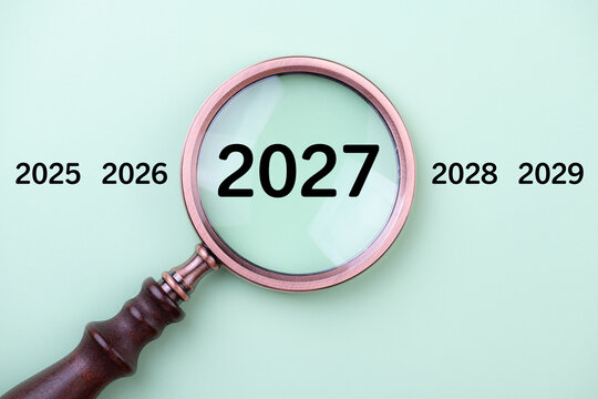 2027 New Year card. New Years goals 2027 with magnifying glass, target icon. Concept 2027 New Year background. Business, resolutions, goals, inspiration, financial, success, ideas