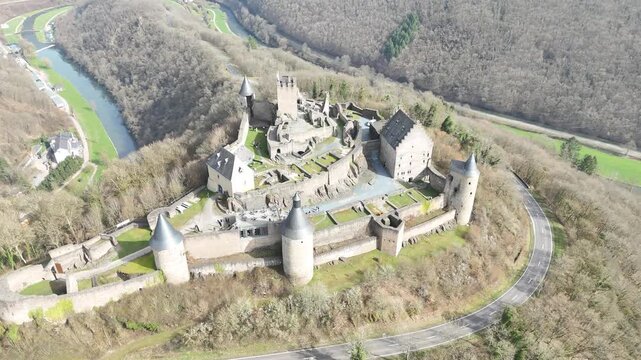 Drone flyover over stone ruins of Bourscheid Castle