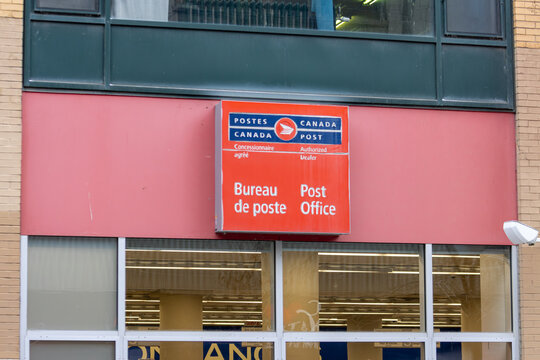 MONTREAL, CANADA, 22 December 2025 : Canada Post Office Exterior Sign, Urban Building Facade, Postal Service