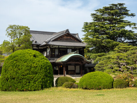 Takamatsu, Japan - April 15, 2018: Commerce and Industry Promotion Hall "Sanuki State Guesthouse" on the grounds of Ritsurin Garden on a sunny day