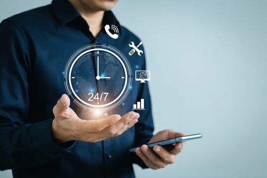 Business person holding a 24/7 digital clock icon. Concept for tech support.