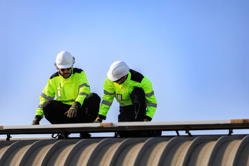 Fototapeta premium solar panel photovoltaic solarenergy electricity renewable.Technicians inspect rooftop solar panels during installation and maintenance, ensuring reliable renewable energy performance and efficient.