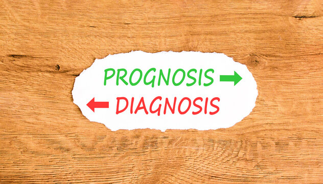 Prognosis vs diagnosis words symbol. Concept words Prognosis Diagnosis on beautiful white paper. Beautiful wooden background. Business medical prognosis vs diagnosis concept. Copy space.