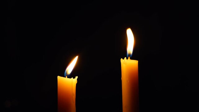 Two Candles lighing in the dark after power cut