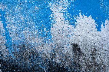 Abstract blue and black textured wall with artistic paint splatters © ornax photo