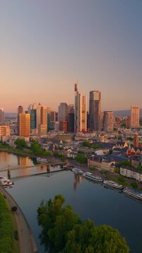 Drone view of Frankfurt&rsquo;s financial district and the Main River during golden hour at sunrise, Germany